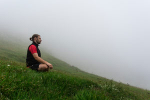 Man, mountains, meadow, meditate, fog Man, mountains, meadow, meditate, fog
